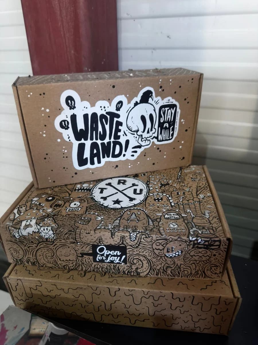 Kraft gift boxes with a custom black illustrated print