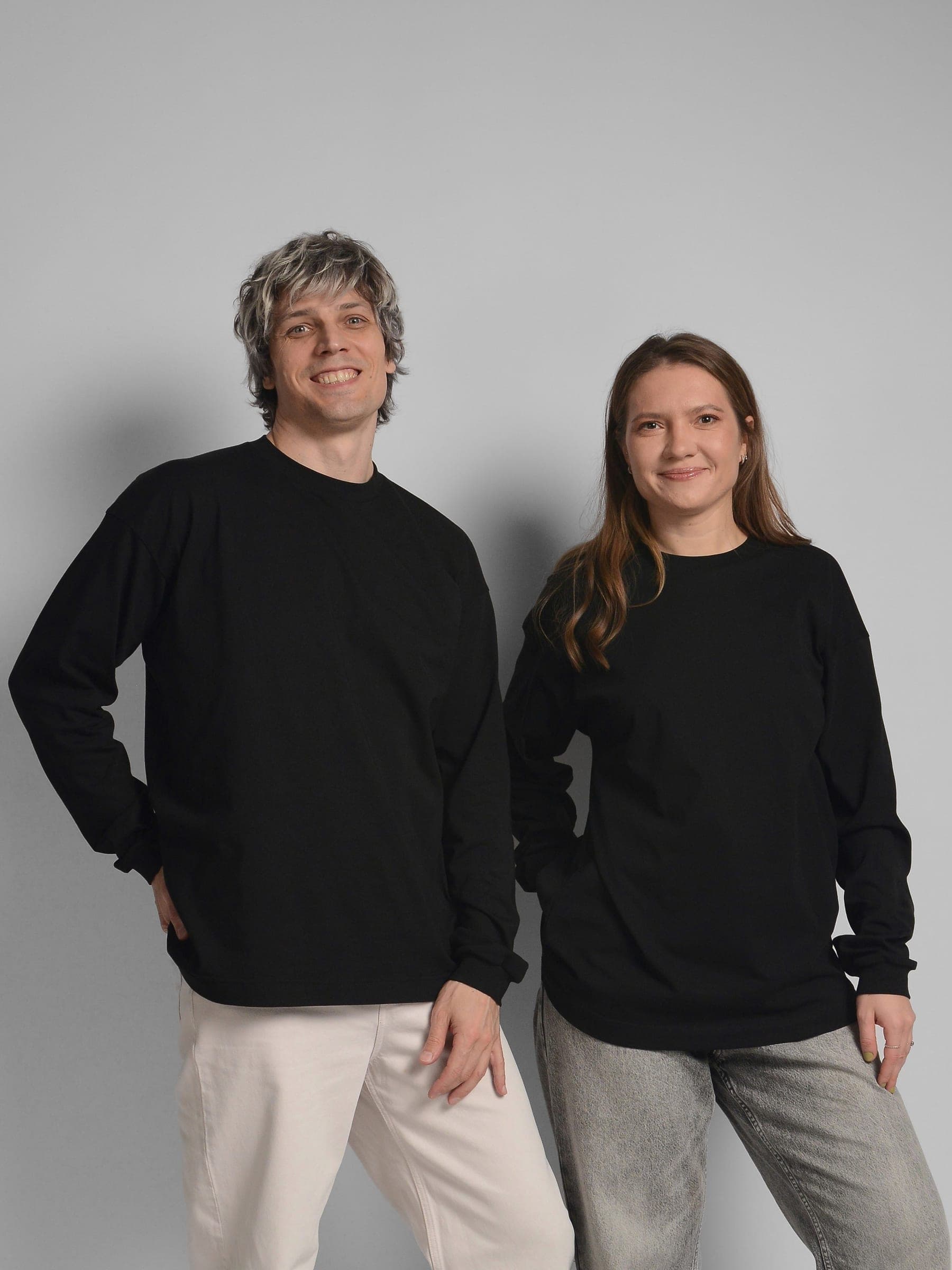 365.APParel Basic Longsleeve Black — couple in matching basics, cropped front view, both smiling, studio