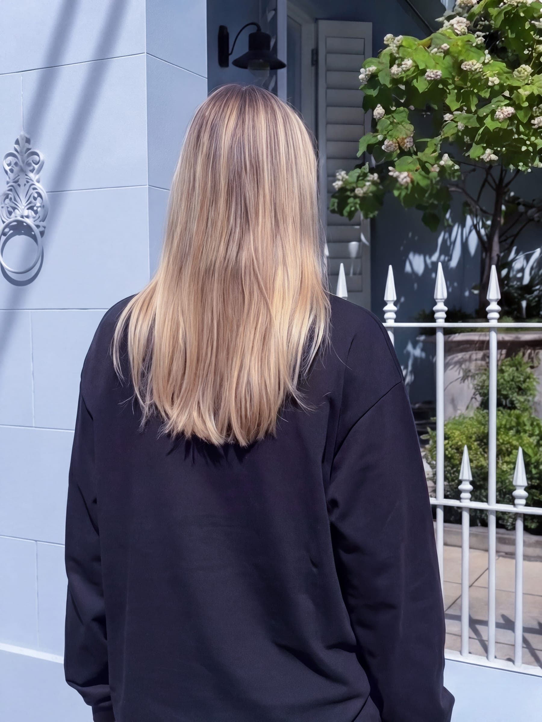 365.APParel Basic Longsleeve Black — woman, full body back view, right hand on hip, studio