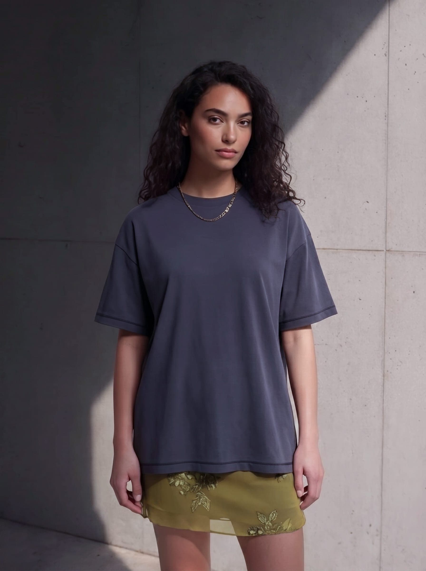 365.APParel Basic T-shirt Graphite — woman, full body front, neutral expression, concrete wall, outdoor