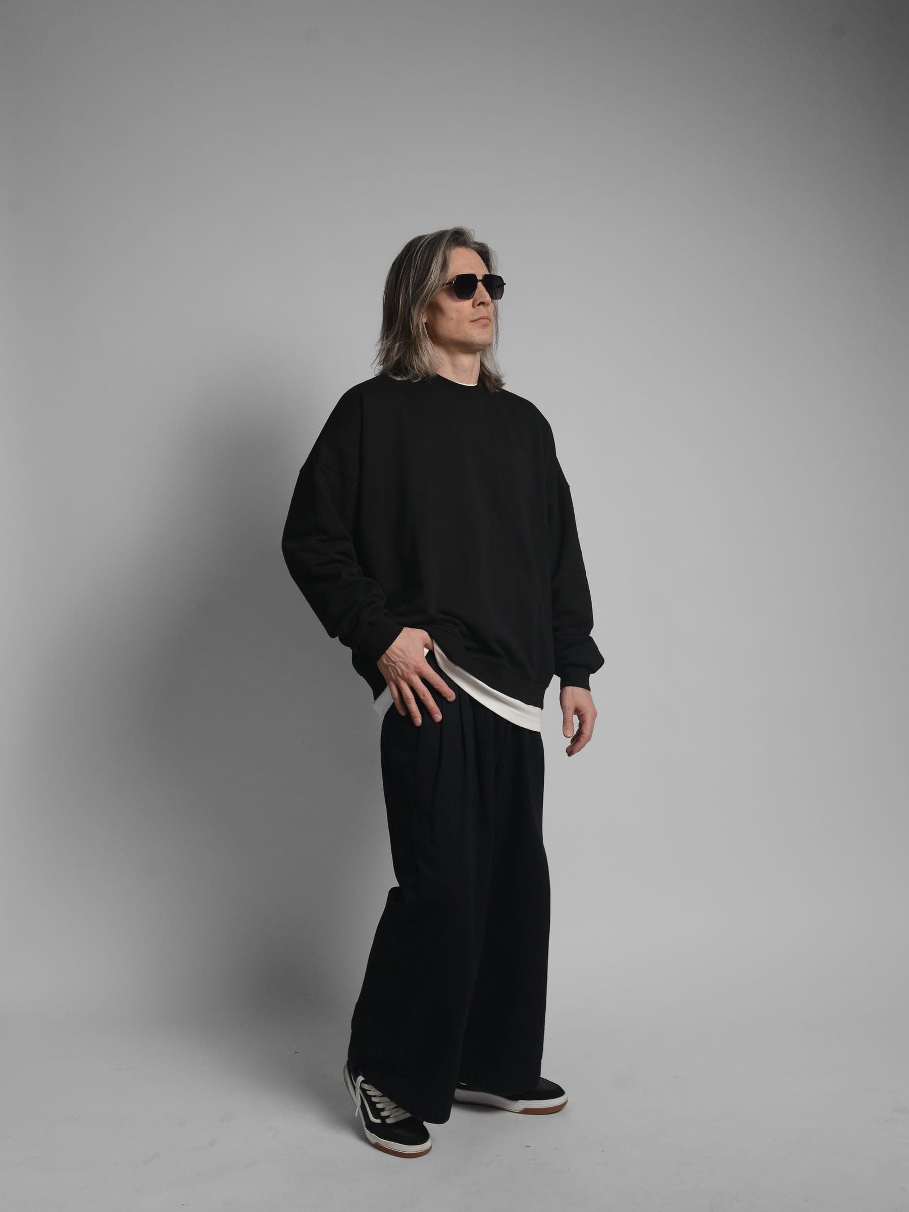 365.APParel Oversize Sweatshirt Black — man, full body three-quarter side view, sunglasses, long silver hair, hand on hip, studio