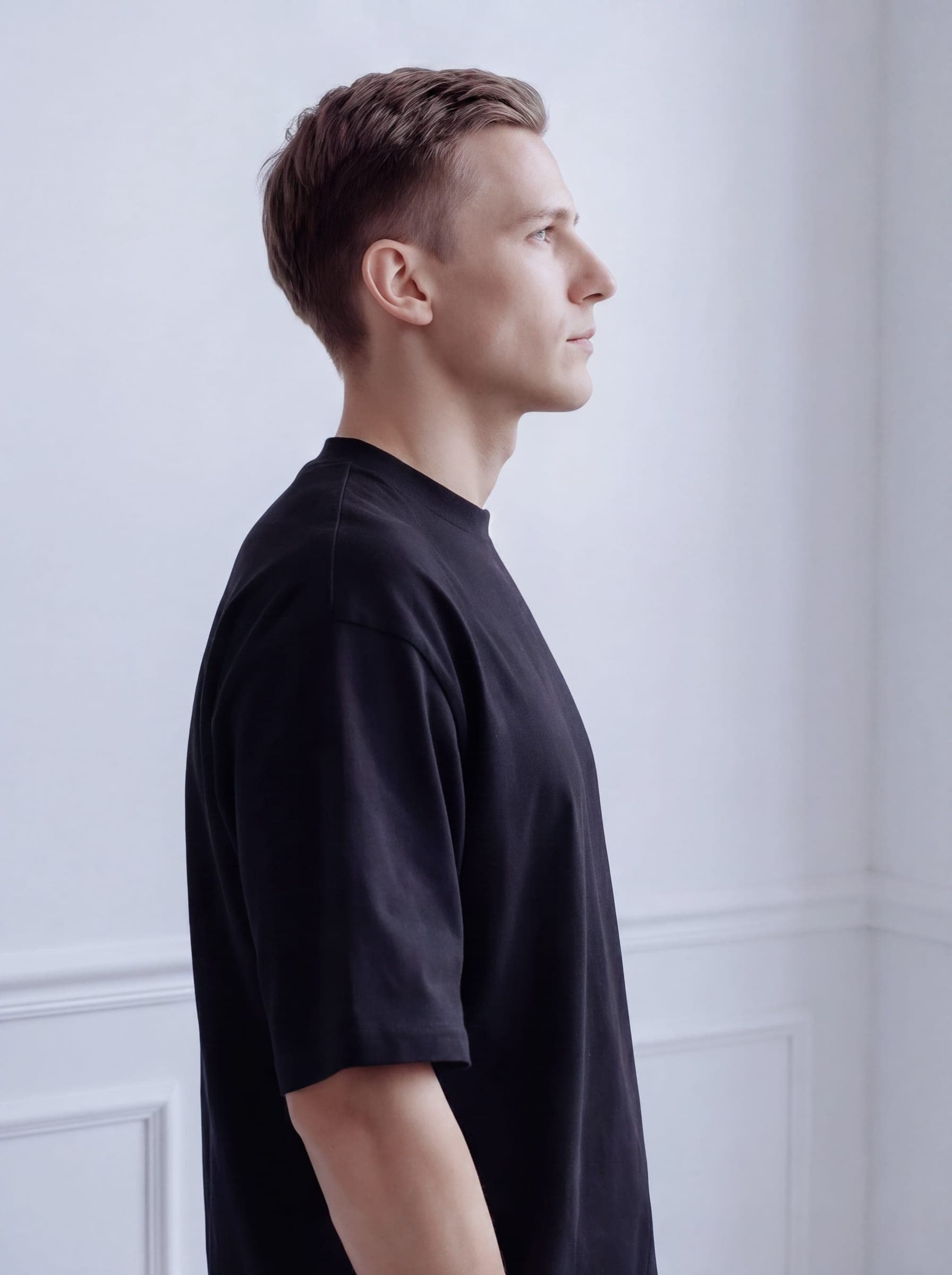 365.APParel Oversize T-shirt Black — man, full body back view, standing, indoor editorial